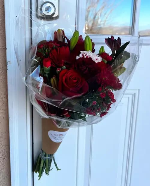 Couple holding a colorful bouquet